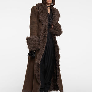 Stay cozy and stylish this winter with our Charlize Suede Coat. This luxurious coat features a soft fur leather exterior, belted waist, and warm lambswool lining. The long sleeve design, turndown collar, and multiple pockets make it both practical and fashionable. Don't sacrifice comfort for style - stay warm and chic with our plush overcoat.