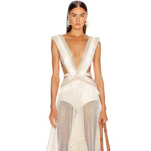 Experience effortless elegance in the PatBO Fringe and Mesh Cutout Maxi Dress. Featuring a deep V-neckline, irregular ruffled details, and a sleeveless design, this dress exudes modern sophistication. The hollow out and tassel accents add a touch of playful flair, making it the perfect choice for any fashion-forward woman.