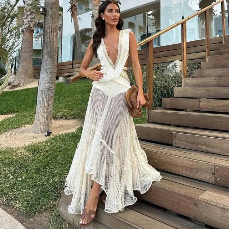 Experience effortless elegance in the PatBO Fringe and Mesh Cutout Maxi Dress. Featuring a deep V-neckline, irregular ruffled details, and a sleeveless design, this dress exudes modern sophistication. The hollow out and tassel accents add a touch of playful flair, making it the perfect choice for any fashion-forward woman.