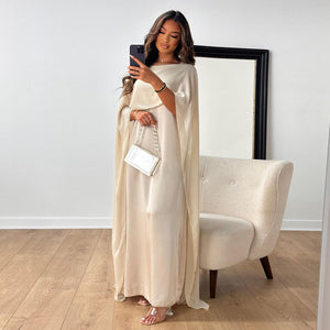 Experience the elegance and comfort of the Robe Solanj. This loose swing robe drapes beautifully, inspired by traditional Middle Eastern designs. Indulge in a luxurious and effortless style. Perfect for lounging or a day out, this robe will elevate your wardrobe and your mood!