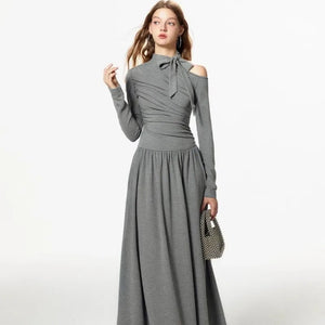 Elevate your wardrobe with our Grey Off Shoulder Pleated Dress for women in autumn and winter. This unique dress boasts a sense of luxury and a flattering slim fit A-line design. Stay stylish and comfortable all season long with Robe Kitty.