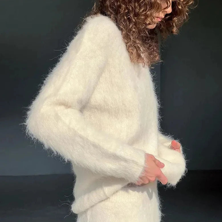 Stay cozy and chic in our Clara Knit Set. Made with a fluffy, mohair knit, this elegant ensemble is perfect for staying stylish during the colder months. Versatile for both winter and autumn, embrace a casual yet fashionable look.