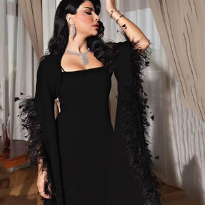 The Adamaris Dress offers a luxurious and elegant look with its trumpet sleeves, square neckline, and sleek black design. Perfect for prom or any special occasion, this dress exudes a sophisticated and sexy vibe. Elevate your style with this statement piece.