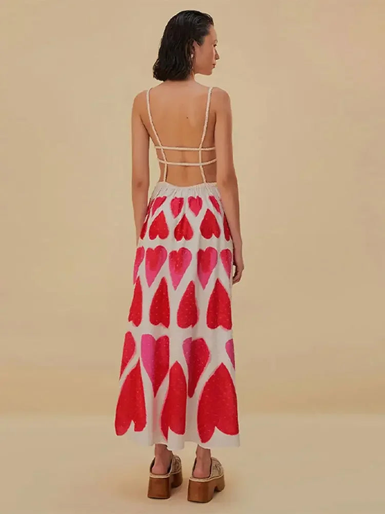 Elevate your style with our Painted Hearts Straps Maxi Dress! The striking red tie dye adds a touch of boldness to the classic spaghetti strap design. With its backless and high waist features, you'll exude confidence and sexiness whenever you wear it. Perfect for a night out or a special occasion.