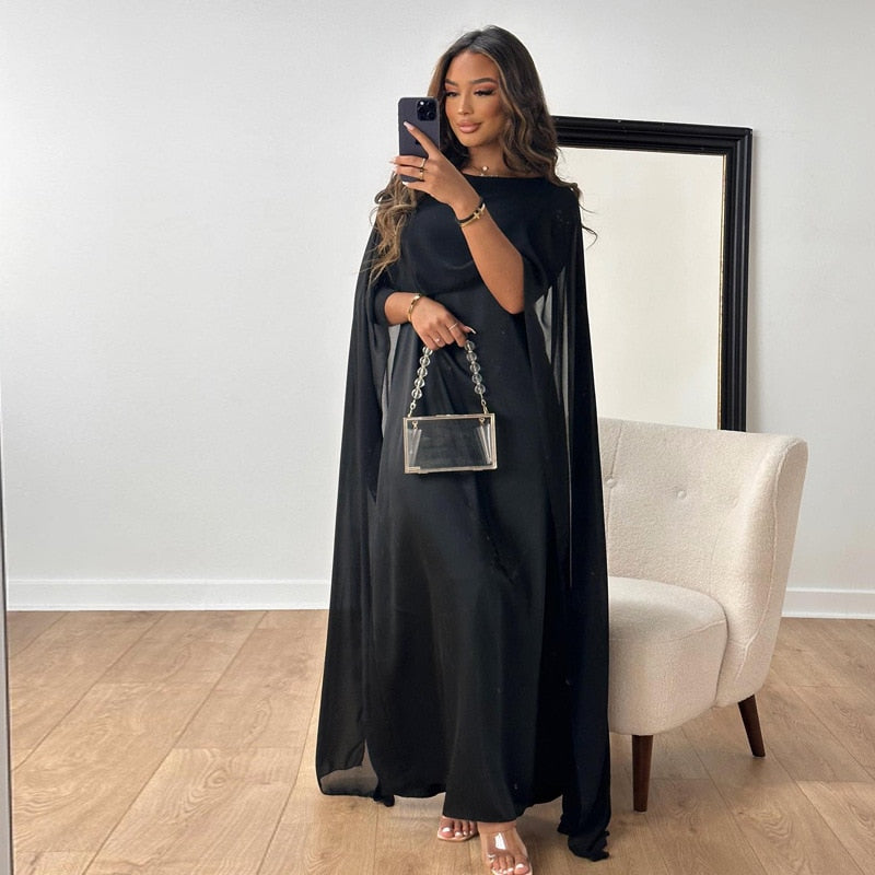 Experience the elegance and comfort of the Robe Solanj. This loose swing robe drapes beautifully, inspired by traditional Middle Eastern designs. Indulge in a luxurious and effortless style. Perfect for lounging or a day out, this robe will elevate your wardrobe and your mood!