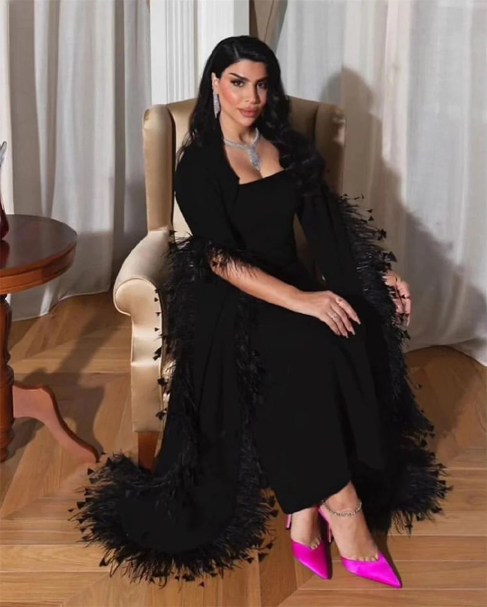 The Adamaris Dress offers a luxurious and elegant look with its trumpet sleeves, square neckline, and sleek black design. Perfect for prom or any special occasion, this dress exudes a sophisticated and sexy vibe. Elevate your style with this statement piece.