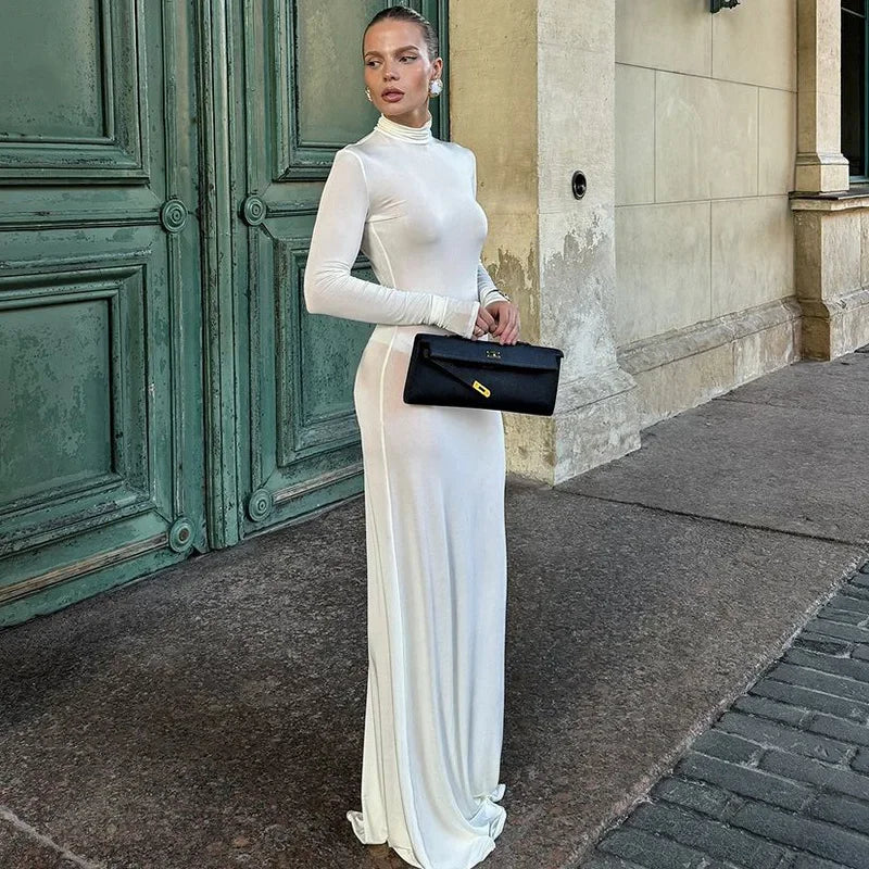 Experience style and comfort like never before with the Valery Dress. With its sleek turtleneck and long maxi design, this bodycon dress is perfect for any occasion. Stand out in the crowd or make a statement at evening events in this bold and daring solid white dress. Perfect for your autumn wardrobe.