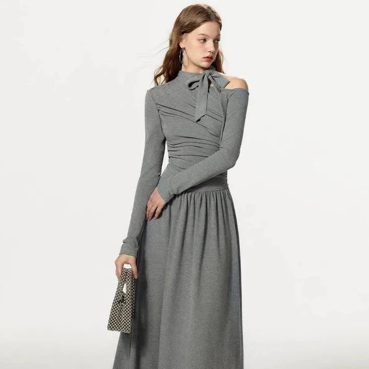 Elevate your wardrobe with our Grey Off Shoulder Pleated Dress for women in autumn and winter. This unique dress boasts a sense of luxury and a flattering slim fit A-line design. Stay stylish and comfortable all season long with Robe Kitty.