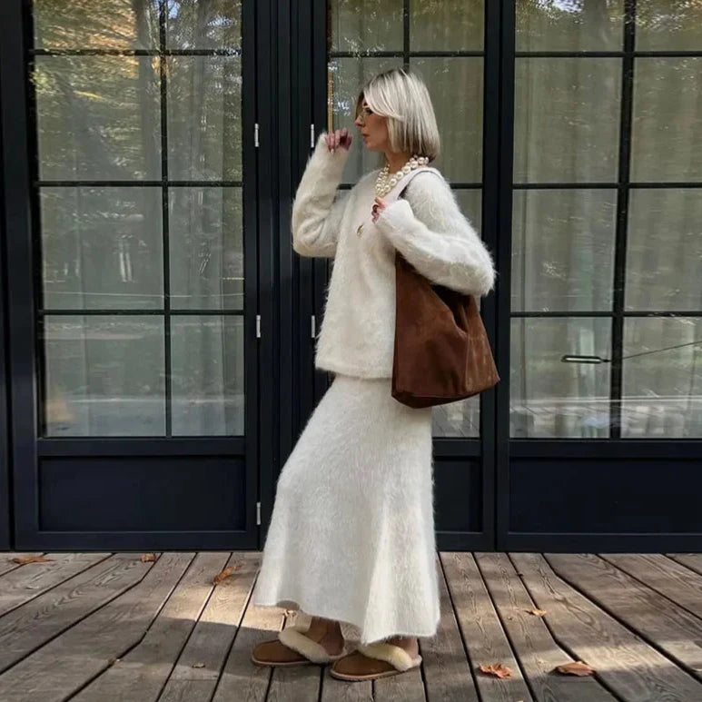 Stay cozy and chic in our Clara Knit Set. Made with a fluffy, mohair knit, this elegant ensemble is perfect for staying stylish during the colder months. Versatile for both winter and autumn, embrace a casual yet fashionable look.