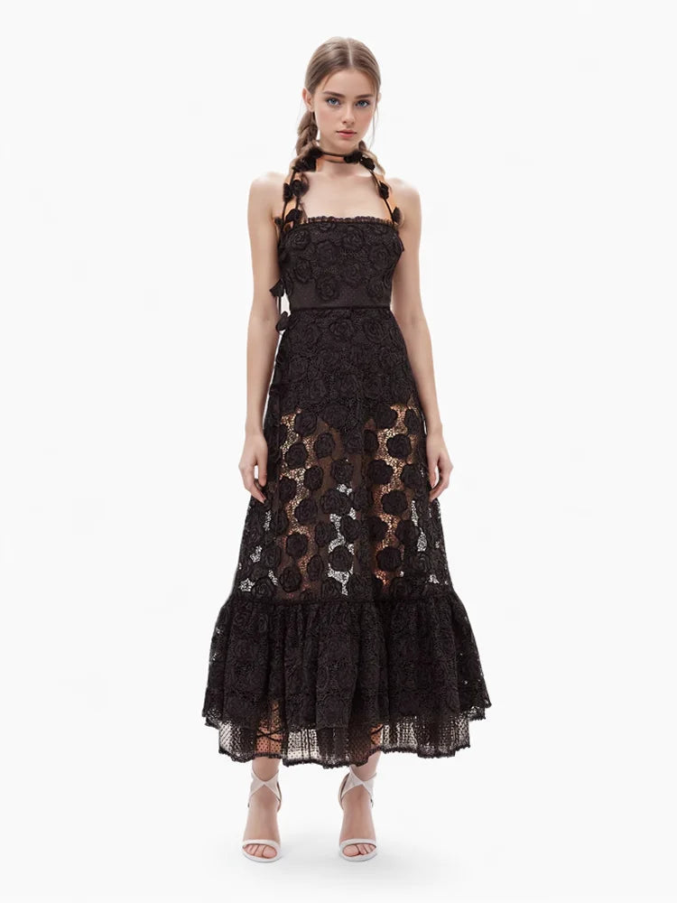 Introducing the Alexis Villanelle embroidered halterneck dress. This elegant dress features a backless design and a sling style, making it perfect for special occasions. With its intricate embroidery, you'll make a statement wherever you go. Experience style and comfort in one with this long dress.