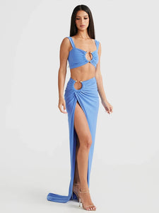 This Ensemble Reanna set features a slim bodycon design with a two-piece set including a spaghetti strap crop top and skirt. The slimming design enhances your figure while the adjustable spaghetti straps allow for a comfortable fit. Elevate your wardrobe with this stylish and flattering set.