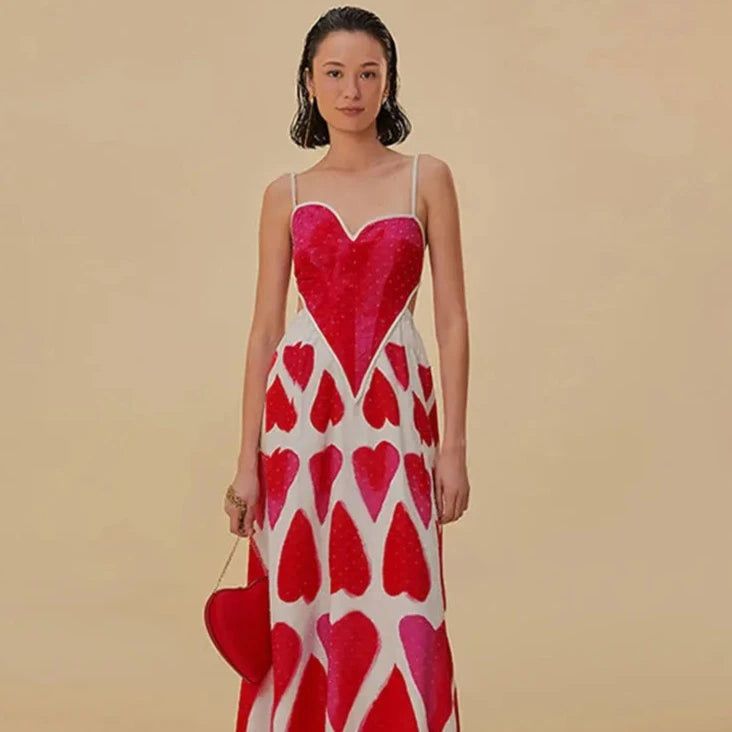 Elevate your style with our Painted Hearts Straps Maxi Dress! The striking red tie dye adds a touch of boldness to the classic spaghetti strap design. With its backless and high waist features, you'll exude confidence and sexiness whenever you wear it. Perfect for a night out or a special occasion.