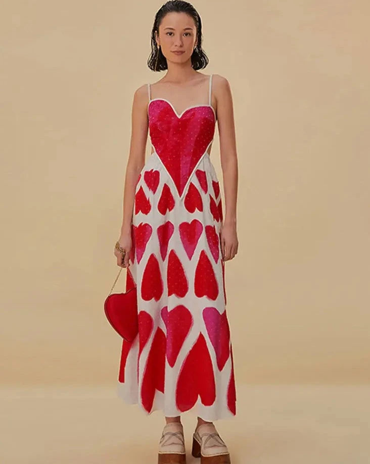 Elevate your style with our Painted Hearts Straps Maxi Dress! The striking red tie dye adds a touch of boldness to the classic spaghetti strap design. With its backless and high waist features, you'll exude confidence and sexiness whenever you wear it. Perfect for a night out or a special occasion.