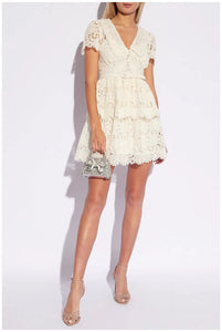 Introducing Flower Lace Mini Dress by Self-Portrait - a reimagined classic for the modern woman. Embodying a signature sensuality and ease, this elegant dress features delicate lace embroidery, feminine short sleeves, and a flattering v-neck. Complete with a sash for added style, it's perfect for any summer occasion.