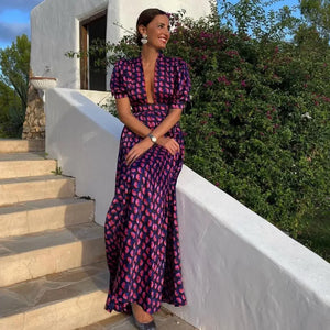 Introducing Alexia's Dress Cotton - the perfect addition to your summer wardrobe. This maxi dress features a beautiful print and flowy fabric, with 1/2 sleeves and a fitted top that flares into a full skirt. From day to night, this delicate dress will effortlessly elevate your style.