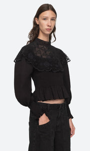 The Serita Top by Sea New York combines delicate crochet lace and intricate stitched pleats for a whimsical and feminine look. Add a touch of elegance and charm to any outfit with this beauty. (Elegant and whimsical, this top is a must-have for any wardrobe.)