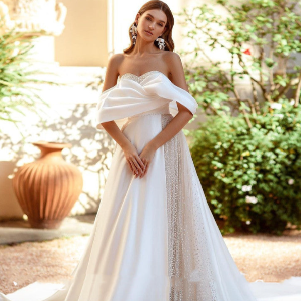 Introducing the Robe Saverine, a stunning a-line wedding gown handcrafted with exquisite French satin. Elevate your special day with this elegant and luxurious dress, designed to make you feel like a work of art walking down the aisle. Embrace the beauty of simplicity and sophistication with this one-of-a-kind piece.