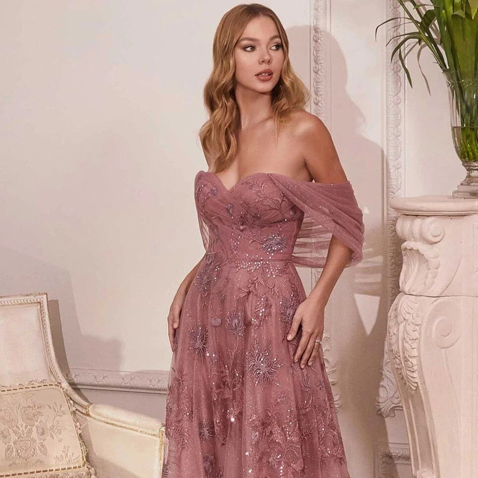 Get ready to sparkle and stun in our Robe Ninette. This elegant gown features a stunning sparkling design that will have you feeling like you're living in a fantasy world. Make a statement at any event or occasion with this one-of-a-kind piece. (Added benefit: guaranteed to turn heads!)