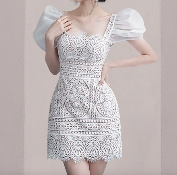 Get ready to slay the fashion game in the Robe Shanon. This elegant lace dress is perfect for any runway or party with its short puffy sleeves and square neckline. Designed for summer, this dress will make you feel sexy and confident.