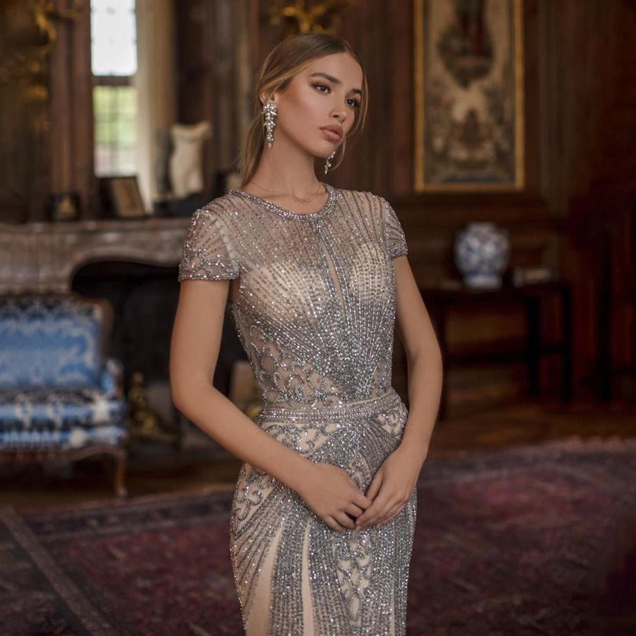 Make a show-stopping entrance in this Robe Sade evening gown! Crafted with a sparkling mermaid silhouette, this glamorous dress will elevate any special occasion. Feel gorgeous and confident in the extraordinary design of this must-have formal look