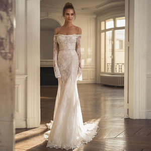 The Robe Margrit is a stunning lace wedding gown, perfect for the elegant bride. This exquisite gown features delicate lace details, adding a touch of romance and sophistication to your special day. Expertly crafted, the Robe Margrit is designed to make you feel beautiful and confident as you say "I do".