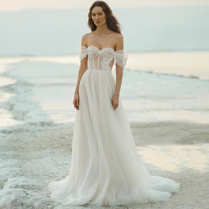 Elevate your special day with the exquisite Robe Francescca. This luxurious white bridal wedding gown exudes elegance and grace, creating an ethereal look. With its intricate design and flawless craftsmanship, you'll feel like a true bride, radiating beauty and sophistication. Make your dream wedding a reality with the stunning Robe Francescca.