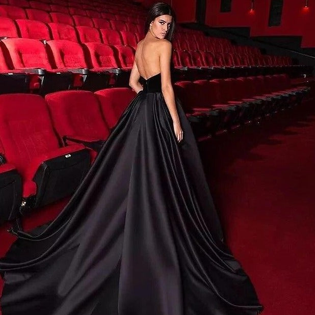 Elevate your evening look with this black robe-styled Yvone dress, made with an elegant strapless design for a perfect fit. Its sophisticated silhouette will have you radiating confidence and glamour at any event.