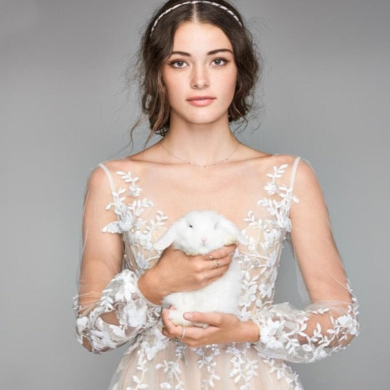 Experience the enchantment and grace of the stunning Robe Freia. Handcrafted with exquisite attention to detail, this timeless gown exudes elegance and charm. Perfect for any formal occasion, it is sure to leave a lasting impression. Elevate your style with the incomparable beauty of the Robe Freia.