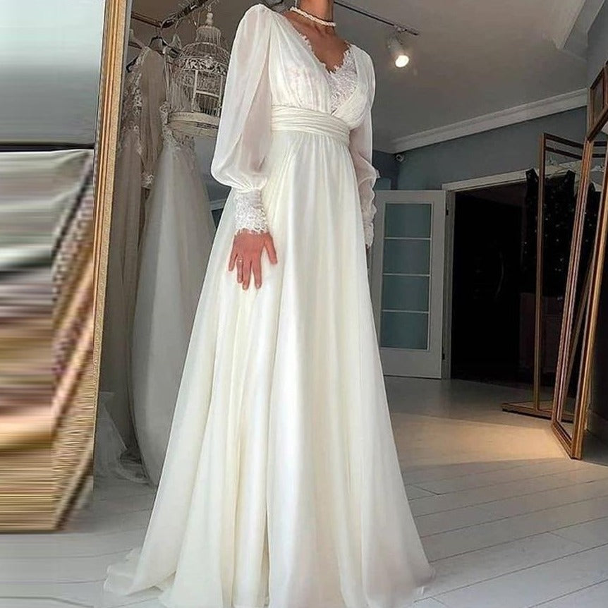 Dress to impress on your big day with the Robe Tiziana. This elegant white lace dress is perfect for any bride looking for a touch of sophistication. With its intricate lace design, it's sure to turn heads as you walk down the aisle. Get ready to say 'I do' in style.&nbsp;