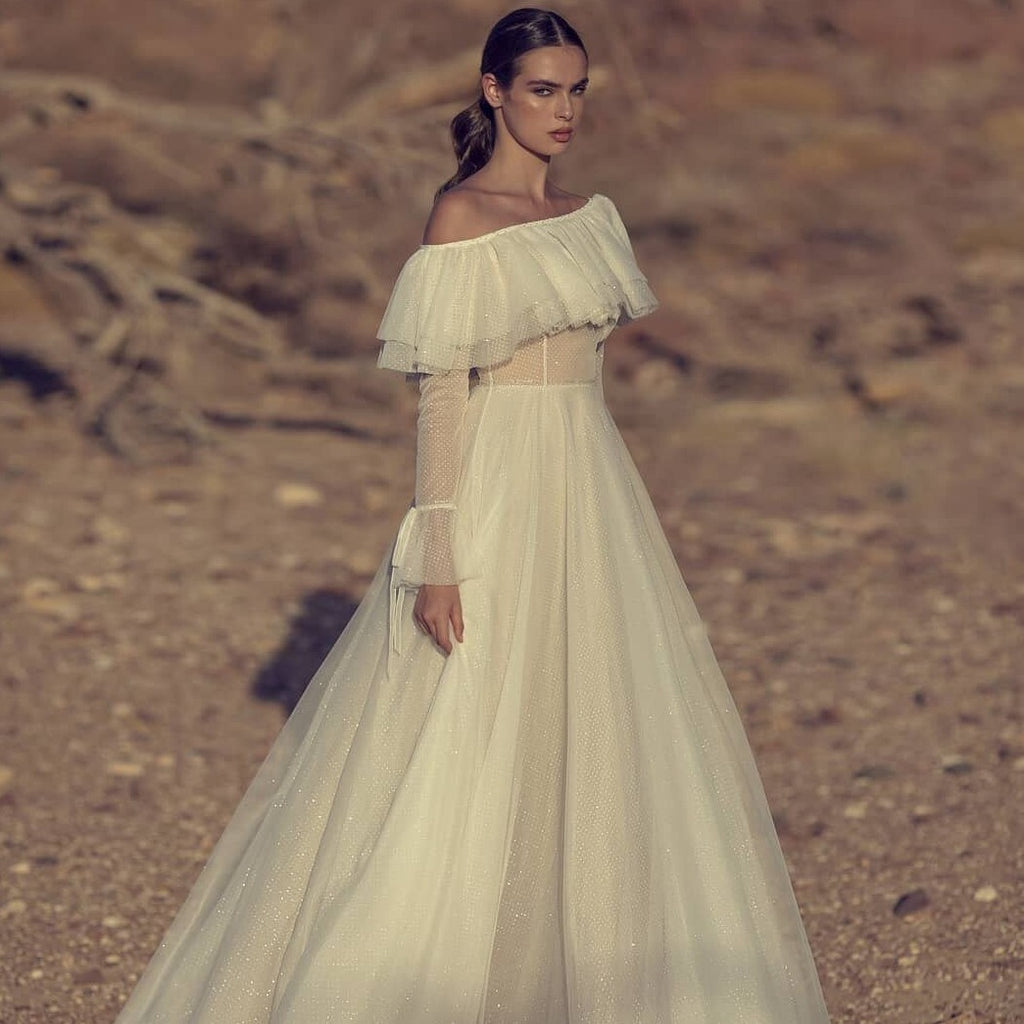 For your grandest day, walk down the aisle in stunning style with the Robe Monique, a beautiful white A-line gown. Boasting a strapless design and soft fabric, this luxurious robe offers timeless sophistication sure to turn heads. Create a look to remember with the Robe Monique.