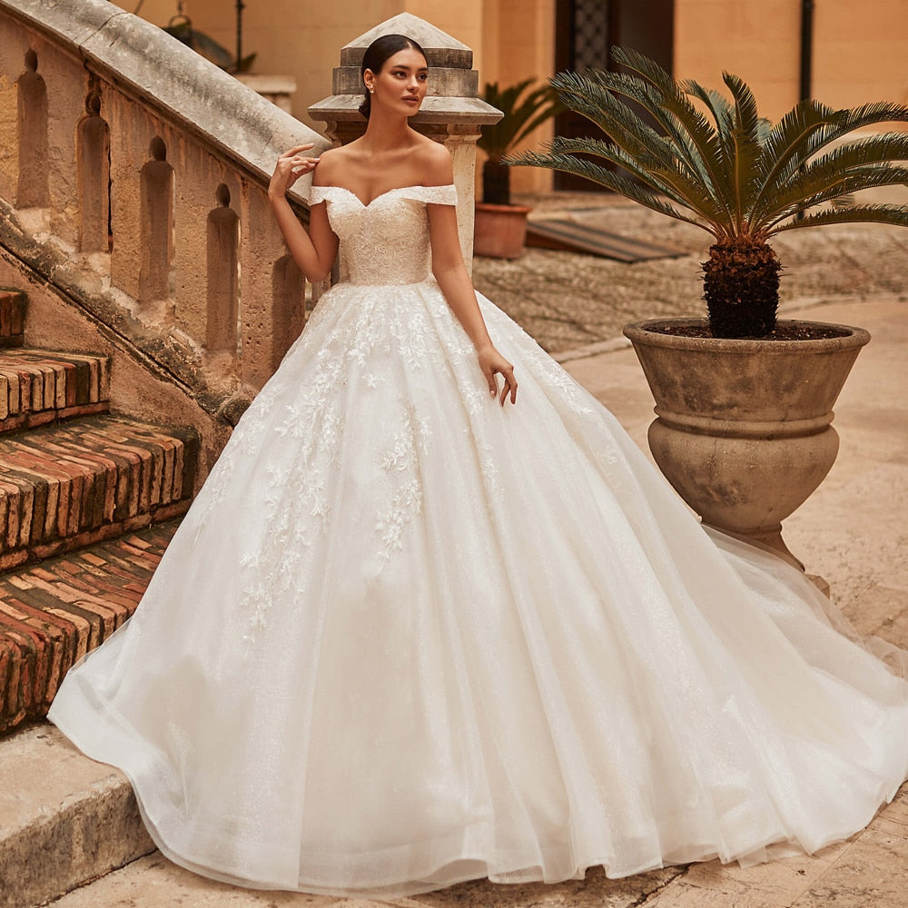 Dare to make a statement on your big day with the Robe Laraine, a stunning, regal gown fit for a queen! The beautiful white fabric exudes elegance, making you feel like royalty as you walk down the aisle. Let your bridal dreams come true with this one-of-a-kind dress.