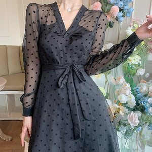 Our Robe Jacquelyne is a timeless classic. Crafted with luxe black dot fabric and beautiful lace for an elegant look, this vintage dress will add a touch of sophistication to your wardrobe.