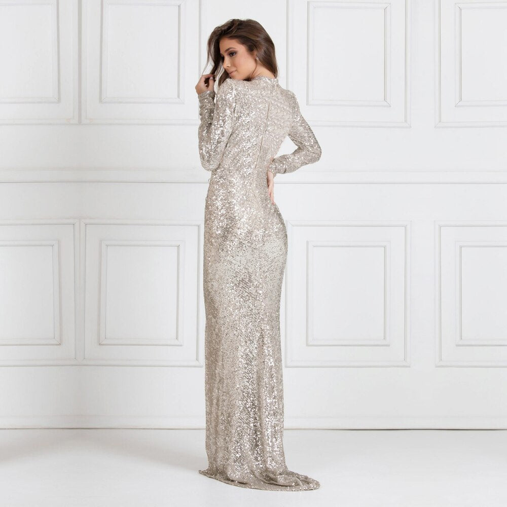 Introducing our Sima Robe, a must-have for any elegant evening event. With its sleek  fabric, this dress exudes sophistication and luxury. Make a statement and turn heads with this stunning piece, perfect for any formal occasion.