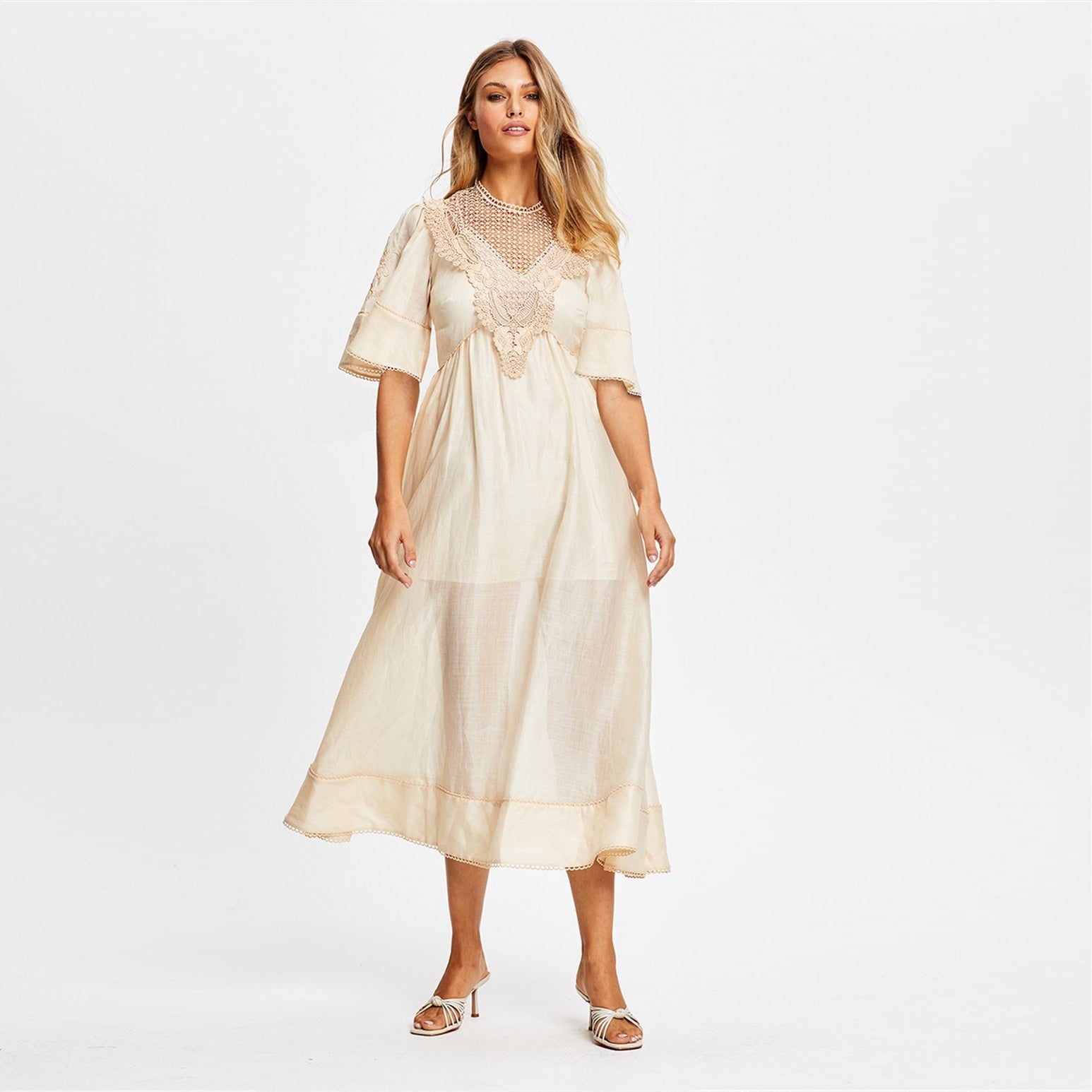 Stay comfortable and stylish with our Robe Scout. Made of lightweight and breathable linen material, this midi dress features intricate lace stitching for a touch of French retro charm. Perfect for any occasion, add this dress to your wardrobe for effortless elegance.