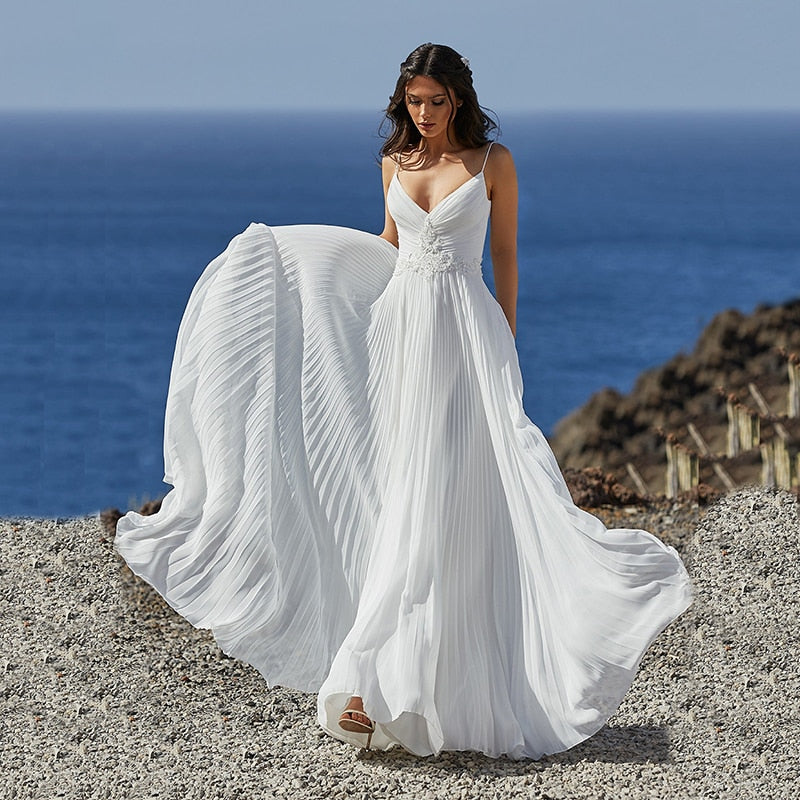 Transform into a vision of elegance with our white, chic boho gown from Robe Chanal. Perfect for any special occasion, this gown will make you feel confident and stylish. Add a touch of sophistication to your wardrobe with this must-have piece!