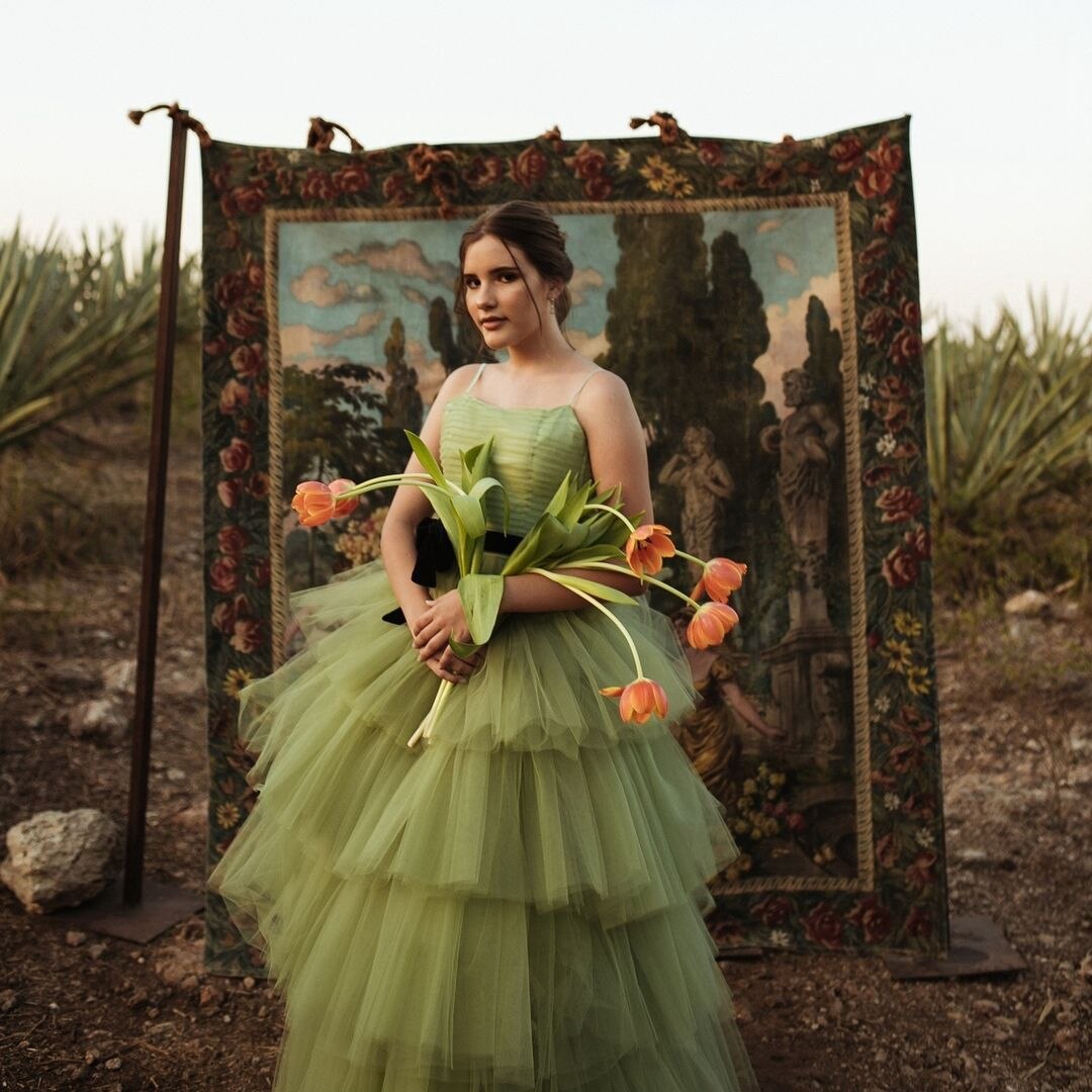 Indulge in the ethereal beauty of the Robe Manaya tulle gown. This artistic green dress will captivate any audience with its delicate fabric and mesmerizing color. Elevate your style and make a statement with this stunning garment.