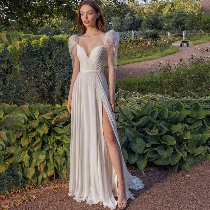 Indulge in the whimsical romance of our Robe Zowey. This elegant fairy bridal gown will make you feel like a magical goddess on your special day. With its flowing fabric and delicate design, you'll be the epitome of beauty and grace as you walk down the aisle. Add a touch of fantasy to your wedding and enchant your guests.