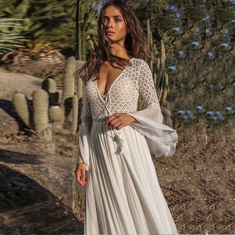 Elevate your wedding look to new levels of adventure with the Robe Esmira. This elegant lace boho style dress exudes confidence and dares you to take risks. Glide down the aisle and create a lasting impression with this bold and inspiring wedding dress.