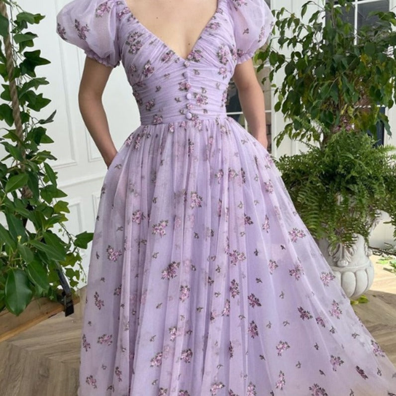 This Lavender Dreams Dress is perfect for any cocktail or formal event. The light and airy floral design will make you feel elegant and stylish. The lavender color brings a calming and dreamy energy to any occasion. Embrace your inner beauty and grace with this stunning dress.