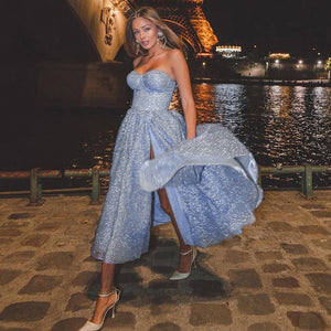 Conquer the night with the Robe Zita! This breathtaking gown features stunning sparkling details and a bold, cocktail blue hue. Be the center of attention and stand out in any event, letting your daring and adventurous spirit shine through. Elevate your style and embrace the thrill of taking risks!