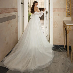 The Robe Ilean is a breathtaking wedding gown made with delicate floral lace and a beautiful bridal train. It exudes elegance and chic style, making any bride feel like a true queen on her special day. With its stunning features, this gown is perfect for those who want to make a statement and leave a lasting impression.