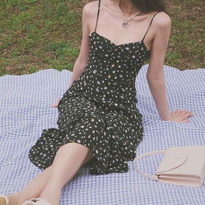 Upgrade your summer wardrobe with our Crimini Slip Dress! This elegant midi dress features a sweetheart neckline, delicate spaghetti straps, and a flirty ruffled hem. Perfect for any occasion, its vintage floral print adds a touch of sophistication. Get ready to turn heads and feel confident in this stylish and versatile dress.