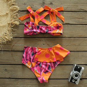 Be beach-ready with the Maillot de bain Marian! This new bikini set features a high waist design and a playful print of dots and florals. The strappy swimwear is perfect for a fun and flirty summer look. Get ready to turn heads at the beach or pool with this sexy and stylish bathing suit.