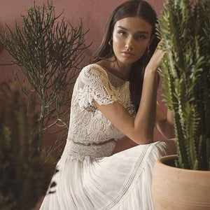 "Wrap yourself in elegance with the Robe Agathe. Embrace your boho-chic style with the intricate bridal lace and sophisticated design. Perfect for any occasion, this robe will make you feel effortlessly beautiful. (Wedding bells not included!)"