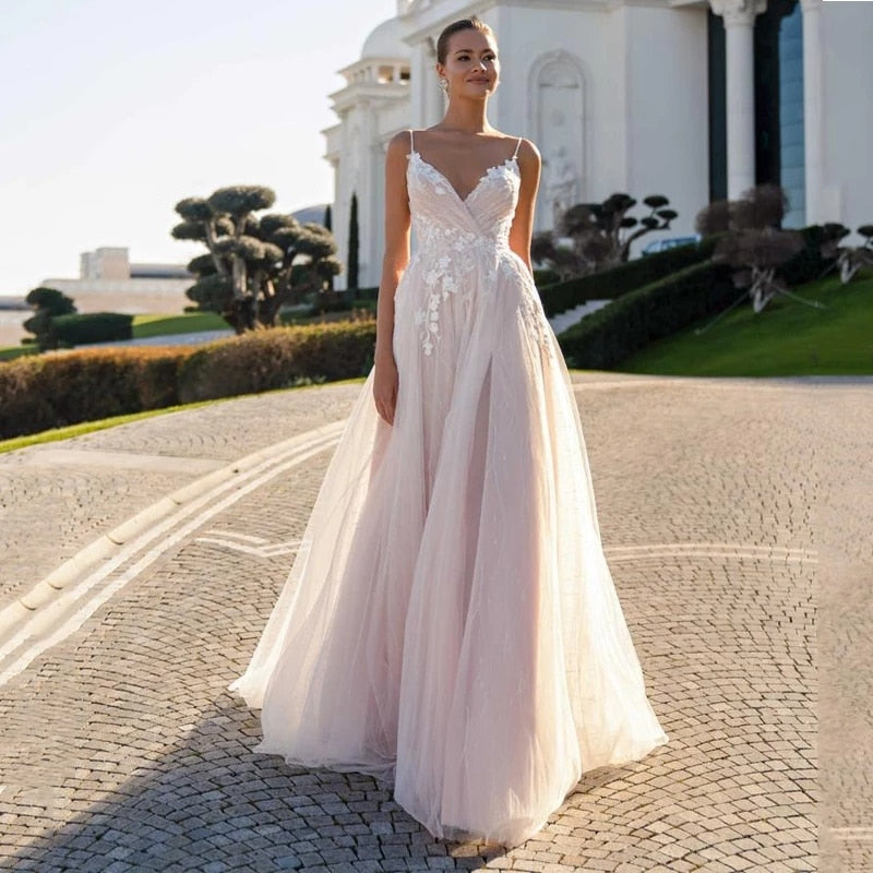 This chic and elegant wedding gown, the Robe Suzee, features a beautiful v-neck and intricate embroidery. Designed for the modern bride, this dress exudes sophistication and style. The v-neck adds a touch of glamour while the embroidery adds intricate detail, making this dress a perfect choice for any bride looking to make a statement on her special day.