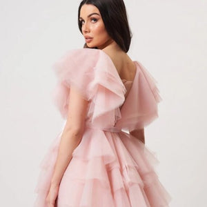 Expertly crafted from delicate tulle, the Robe Anemarie is a stunning dress that exudes elegance and grace. With its lightweight and airy fabric, it offers a comfortable and feminine fit that will make you feel like a true fashionista. Perfect for special occasions, this dress is sure to turn heads and make you feel beautiful.