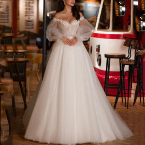 Experience effortless elegance in the Robe Tamie bridal gown. This exquisite a-line dress is ethereally beautiful and perfect for any bride looking for a classic look with a touch of modernity. Featuring a timeless silhouette and delicate detailing, this gown will make any bride feel elegant and radiant on her special day.