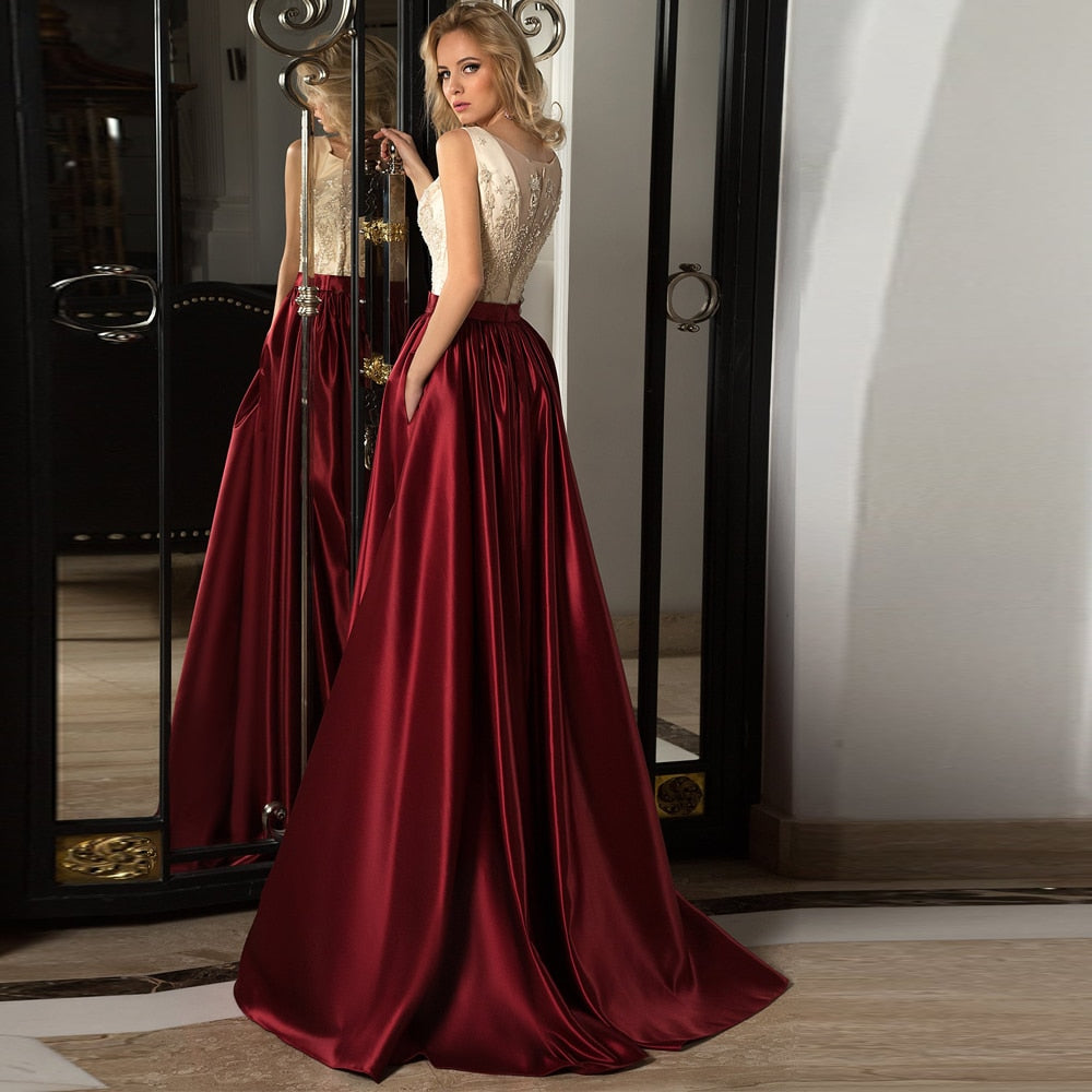 Introducing the Robe Salina - the perfect evening gown for any special occasion. Crafted from elegant burgundy satin, this gown exudes sophistication and style. Make a statement and turn heads with this stunning piece that will make you feel confident and beautiful.