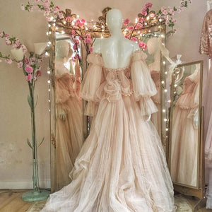 Indulge in the fanciful charm of the Robe Denisse. This beautiful ball gown dress, made of soft pink tulle, will transform you into a princess for any special occasion. Say yes to whimsy and grace in this stunning robe. (Tiara not included!)