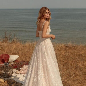 Unleash your inner bohemian goddess with the Robe Hana. This exquisite bridal dress exudes effortless elegance and timeless style, perfect for the free-spirited bride. With its boho-inspired design and intricate details, the Robe Hana is the ultimate choice for a luxurious and exclusive wedding day look.